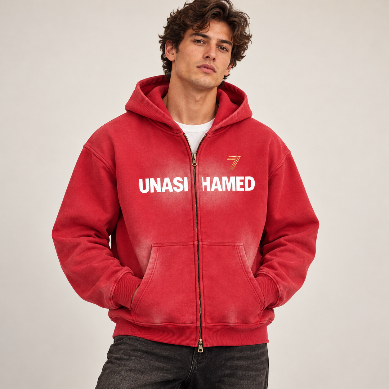 Model wearing the red Seven Loaf UNASHAMED two-way zip hoodie with its original front artwork